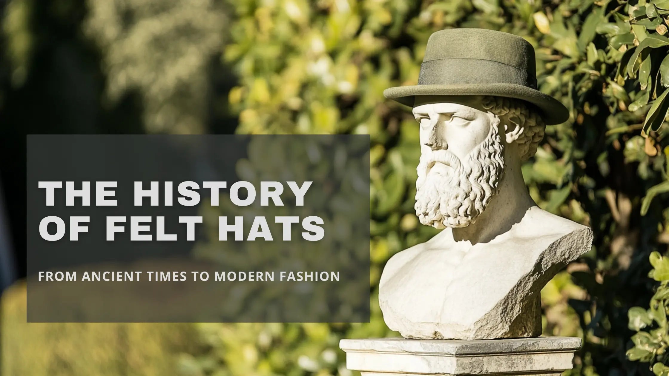 Statue of a classical figure wearing a felt hat with text overlay 'The History of Felt Hats - From Ancient Times to Modern Fashion' against a lush green background.