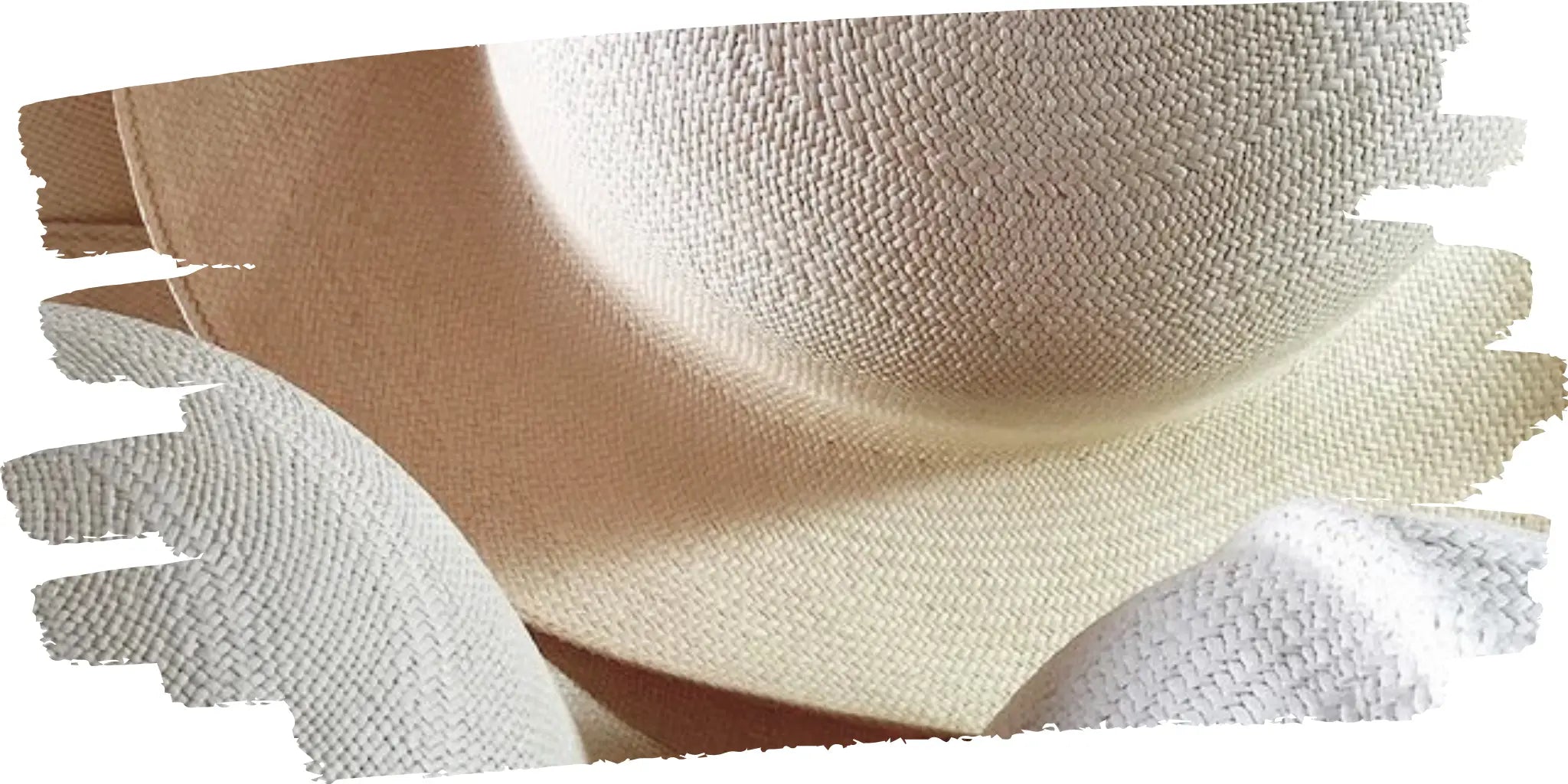 Close-up view of toquilla straw hats in natural cream color, highlighting the intricate weave and smooth gradient shading, perfect for stylish, breathable summer wear.