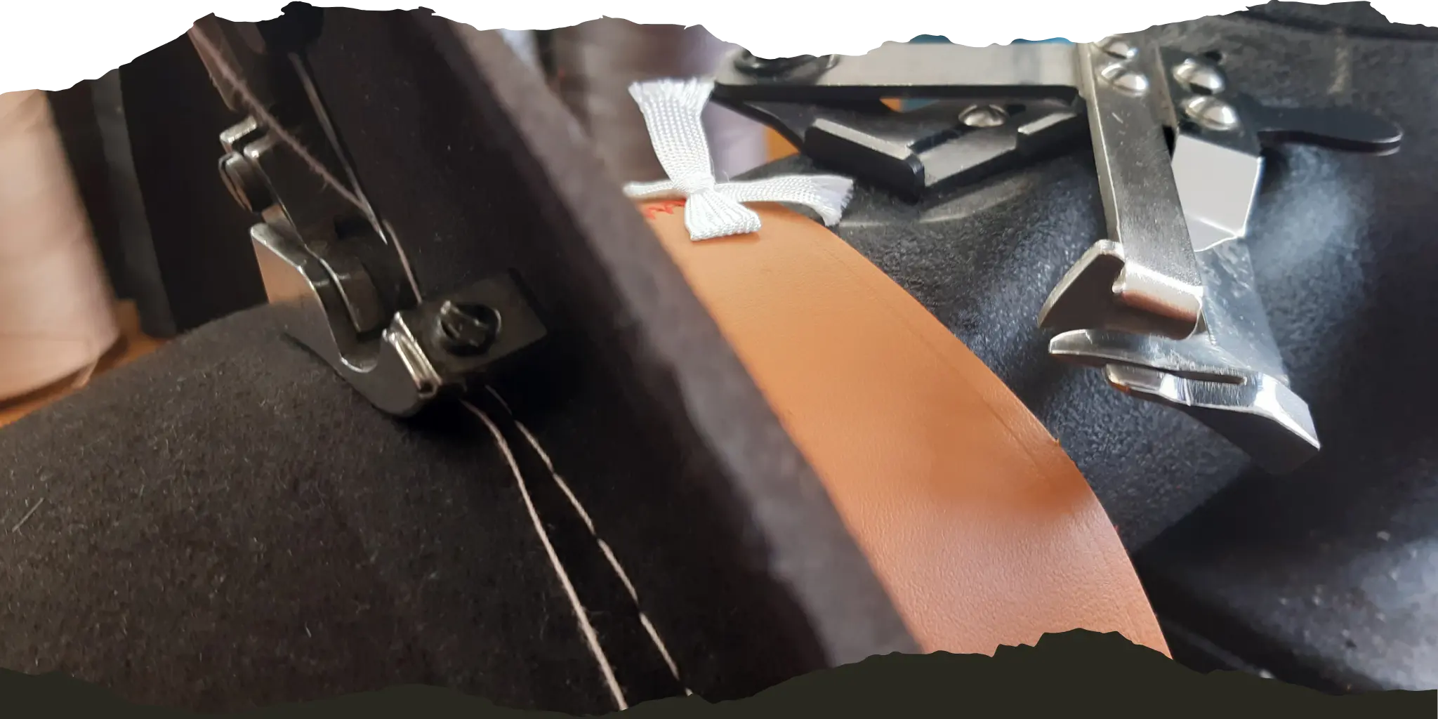 Close-up of artisan tools and materials used in hat making, including a leather sweatband sewing machine and ASM sweatband guide.