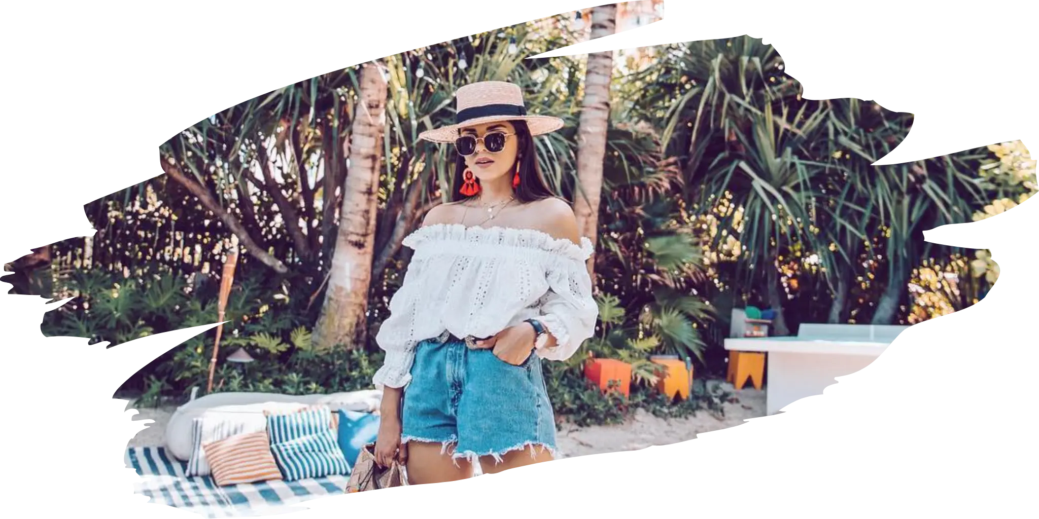 Stylish woman wearing a straw felt hat by Agnoulita Hats, paired with a summer outfit in a tropical setting, perfect for vacation wear.